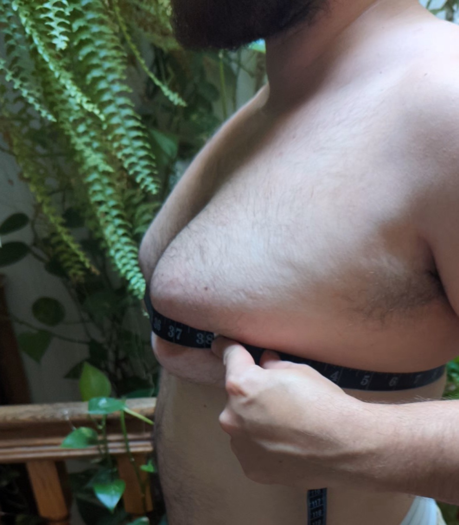 Measuring chest apex circumference with a tape.